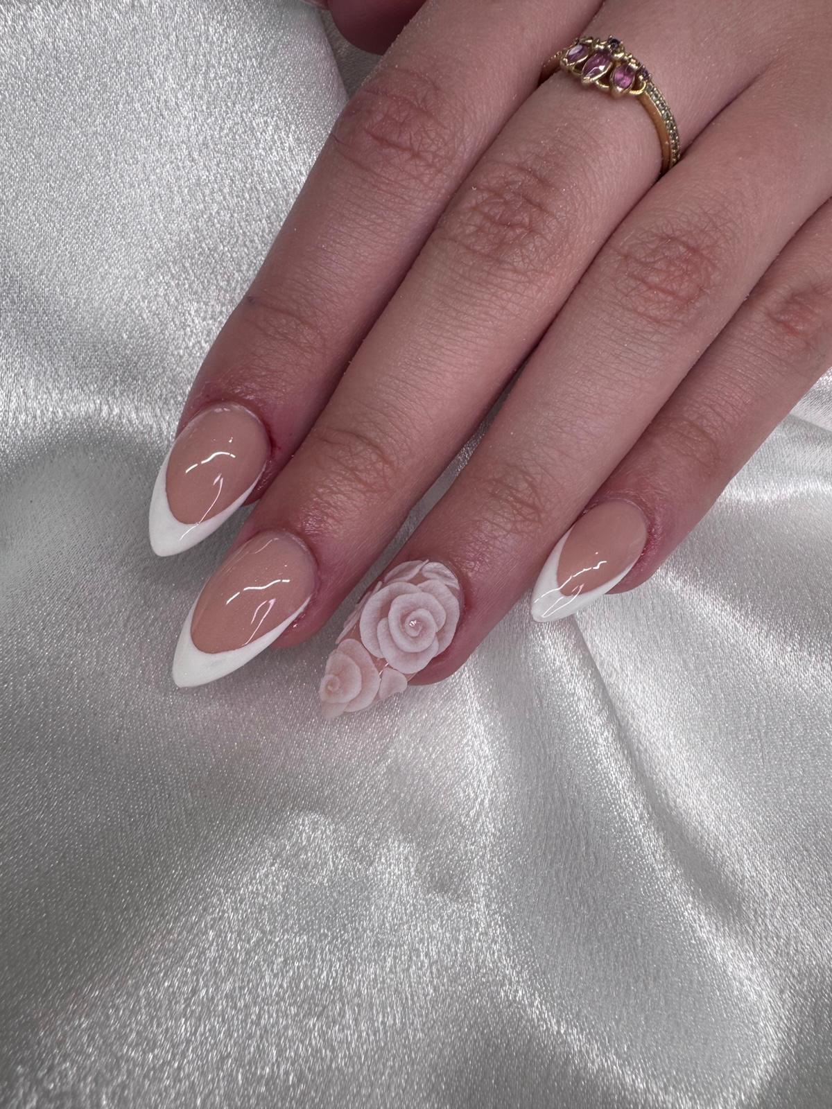 White French tips with a 3D rose accent nail